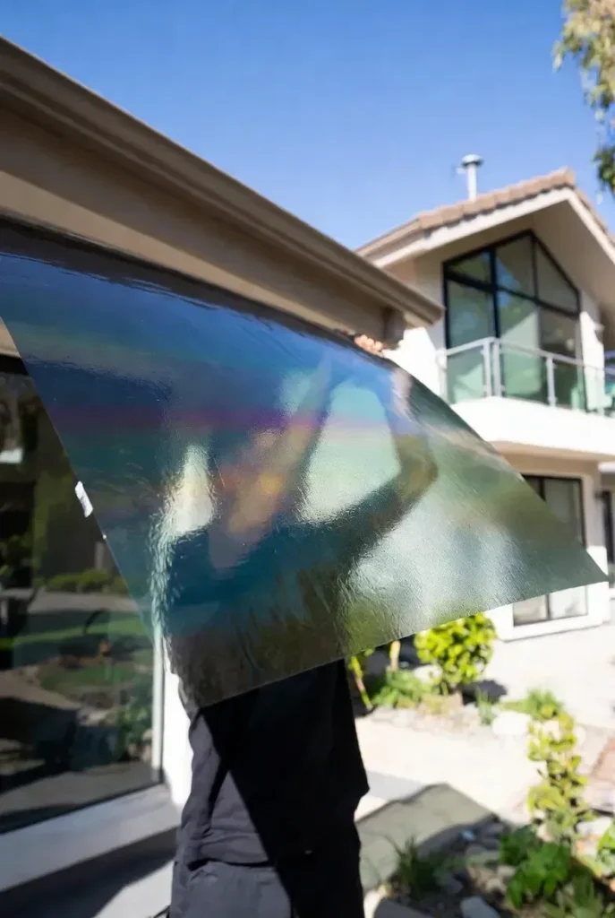 Professional residential window tinting installation on modern Melbourne home for privacy and energy efficiency